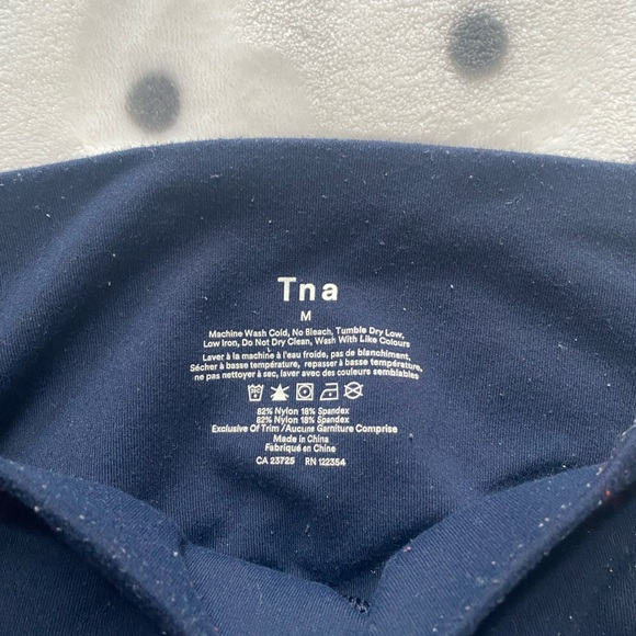 Navy blue TNA leggings with stripes going down the side - Picture 3 of 4